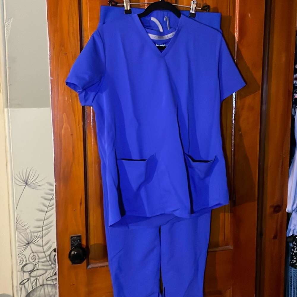 large blue fabletics scrub set